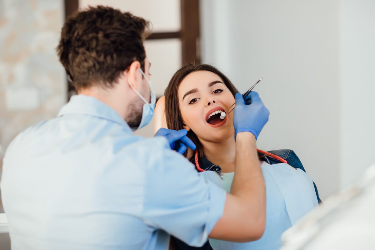 Dentist making professional teeth cleaning